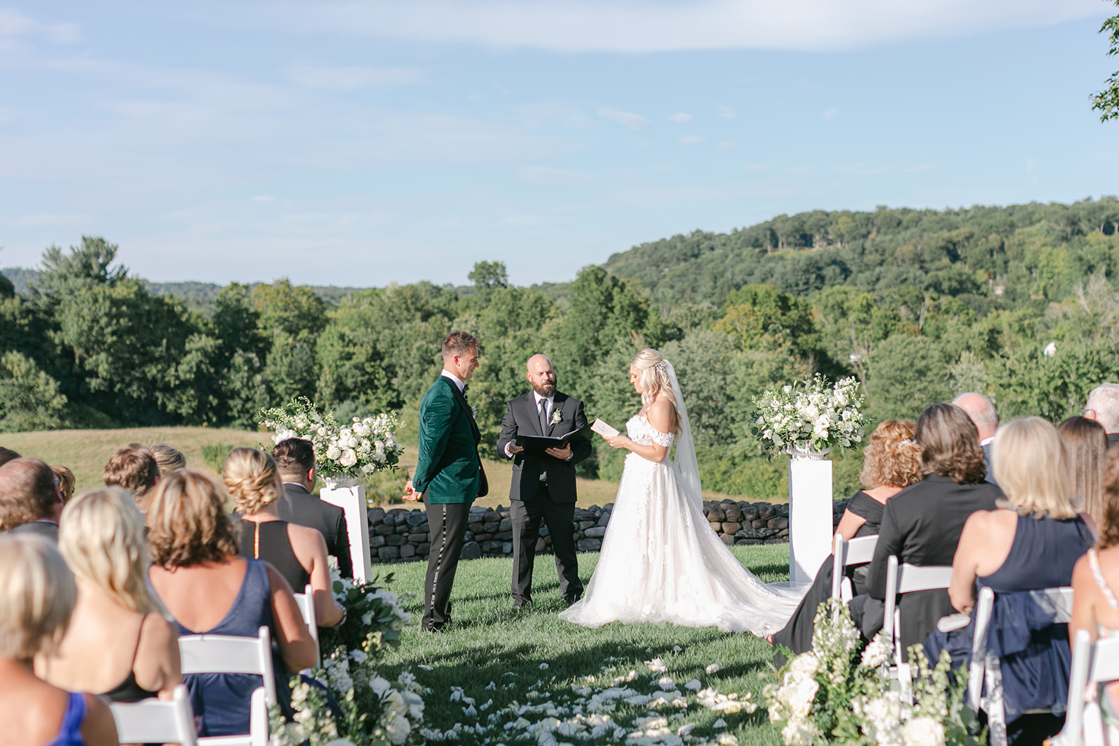 Bride and groom exchanging vows at hillstead museum wedding ceremony