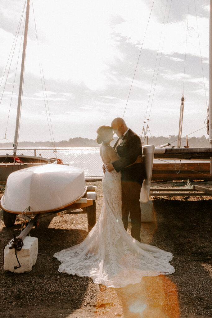 Roton Point Beach Club wedding couple in front of water and boat