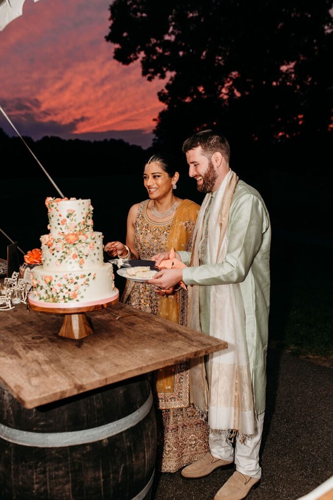 bride and groom in traditional indian wedding attire at wedding reception in connecticut