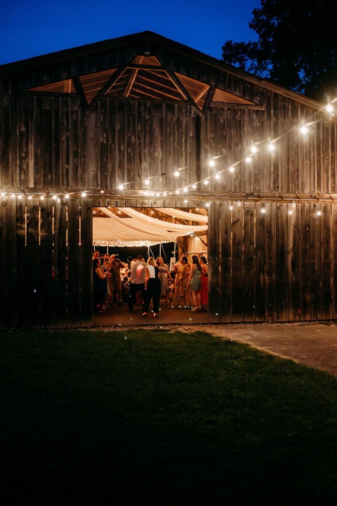 outside of barn during a wedding reception at night