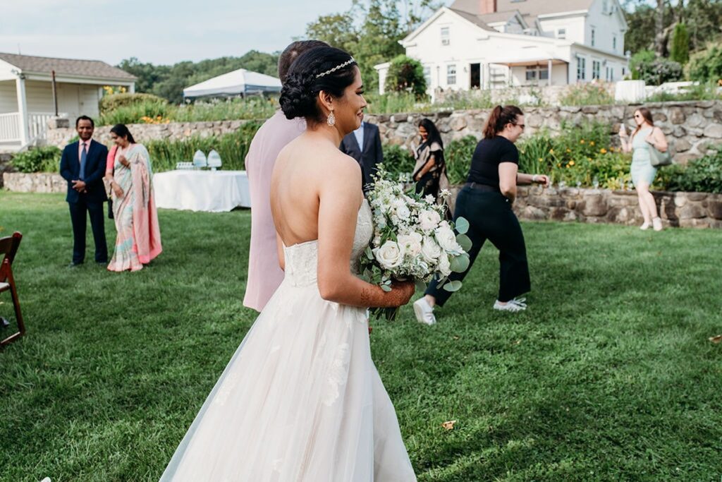 bride walking down the aisle in outdoor connecticut wedding ceremony